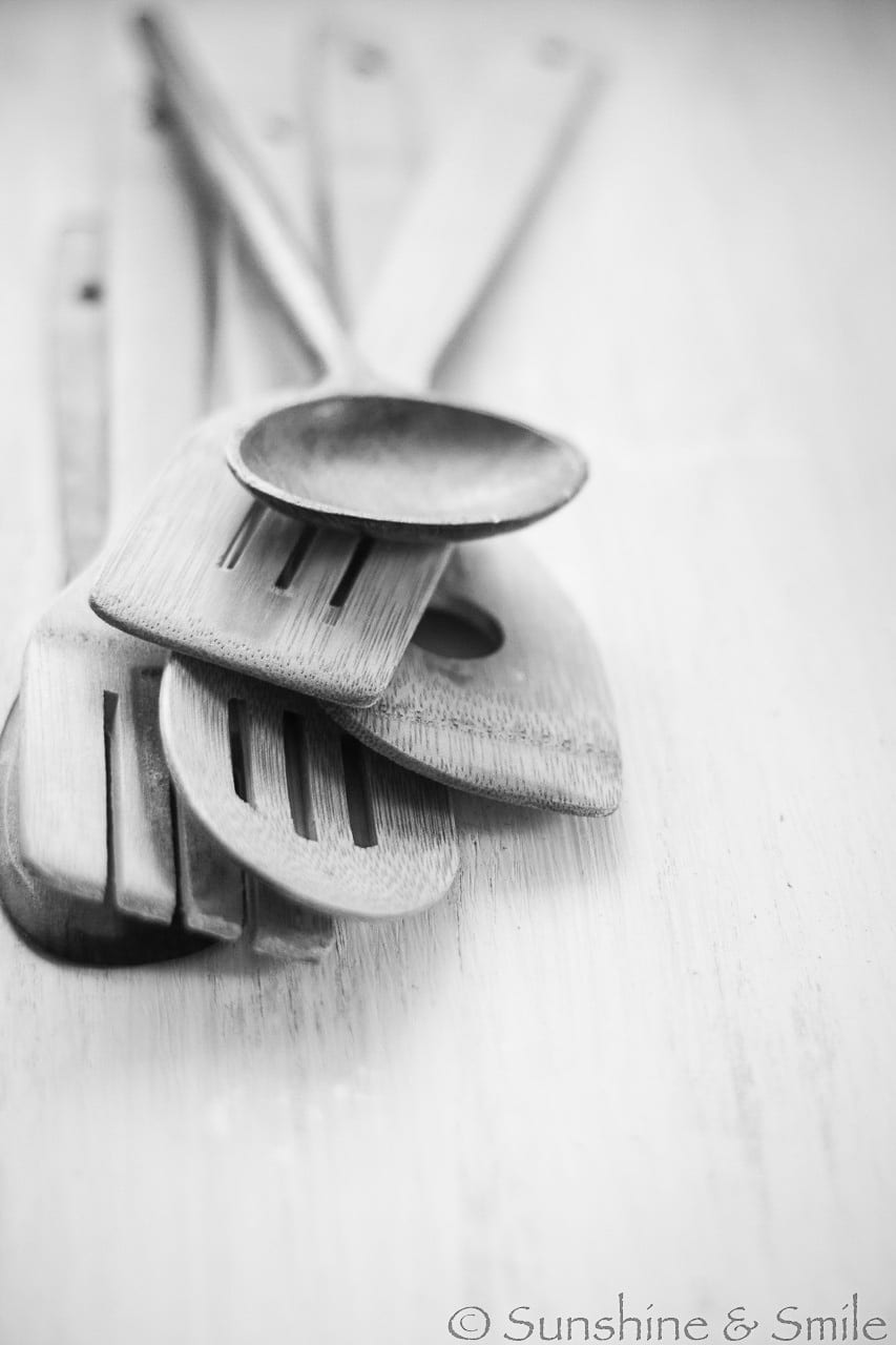 black and white photo of kitchen ladles