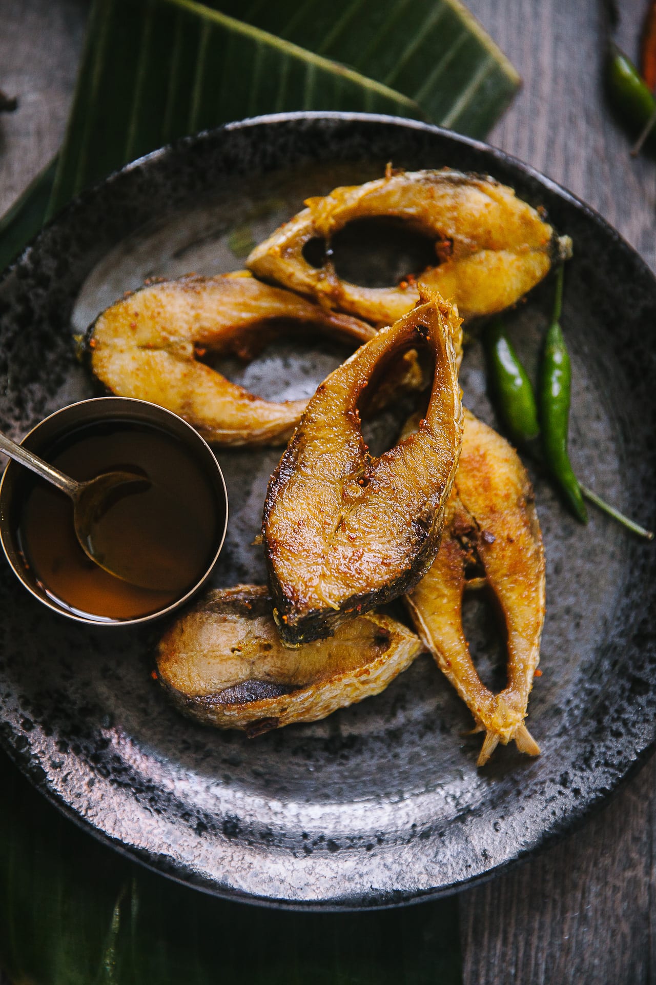 Few hilsa fish fried and kept on a plate 