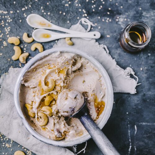 Creamy Tahini Ice Cream in a big bowl with a scoop