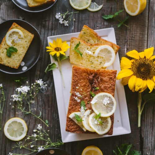 Over the top view of the Lemon Mint cake, with slices styled on individual plates