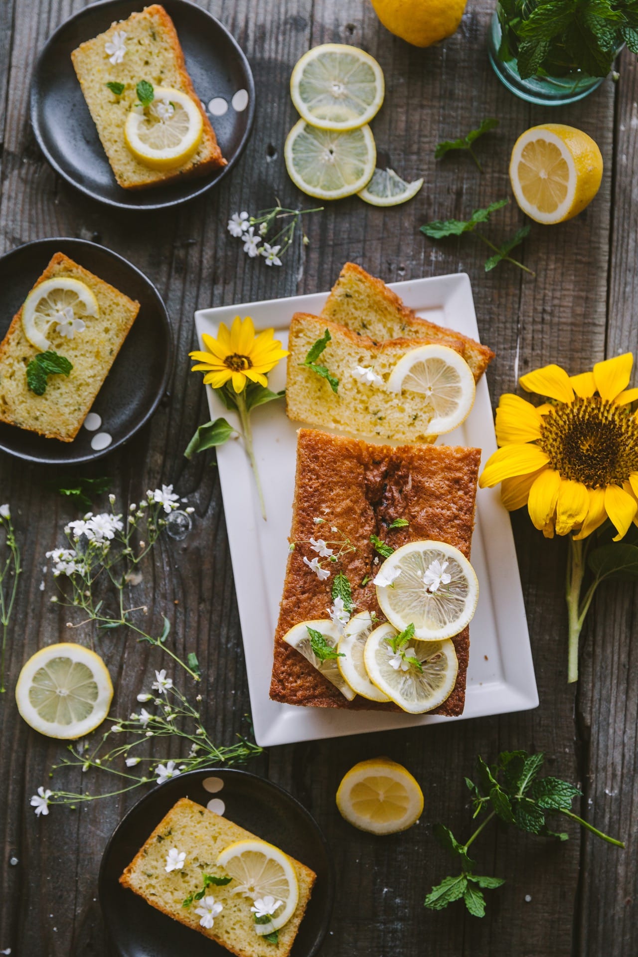 Over the top view of the Lemon Mint cake, with slices styled on individual plates