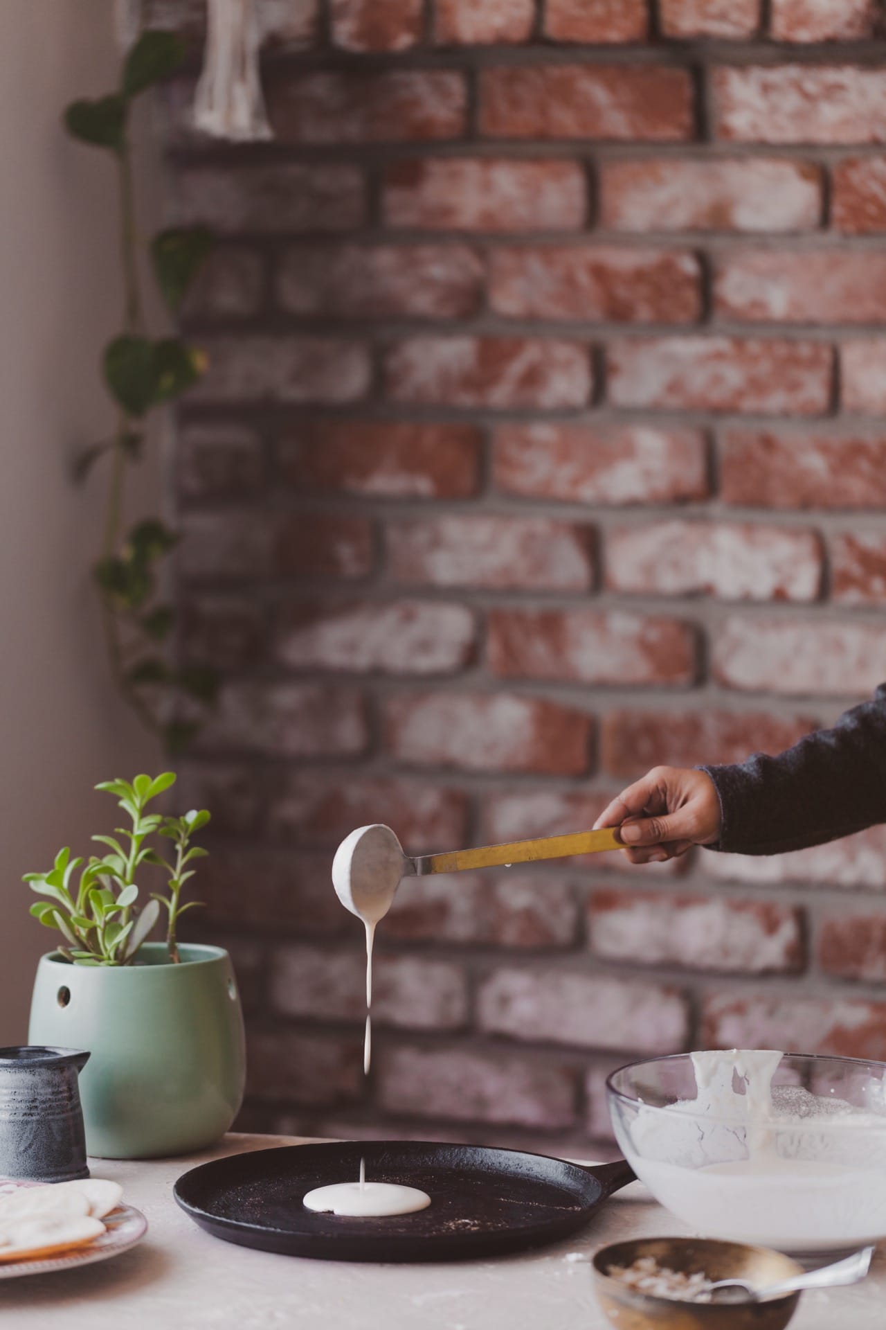 Pouring the eggless pancake batter to a skillet