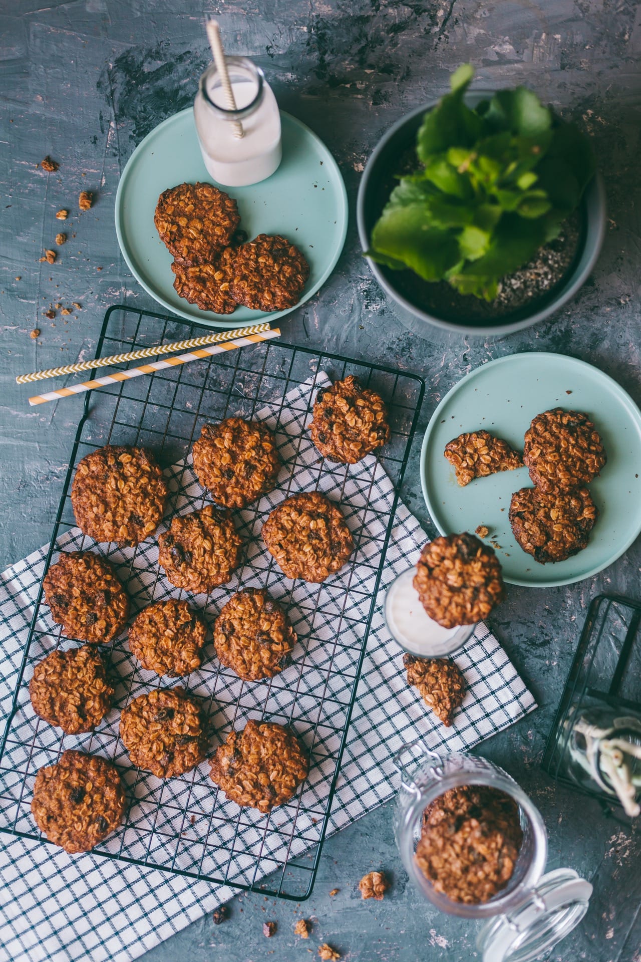 Flat lay of cookies on cooling wire rack with a glass of milk on the side