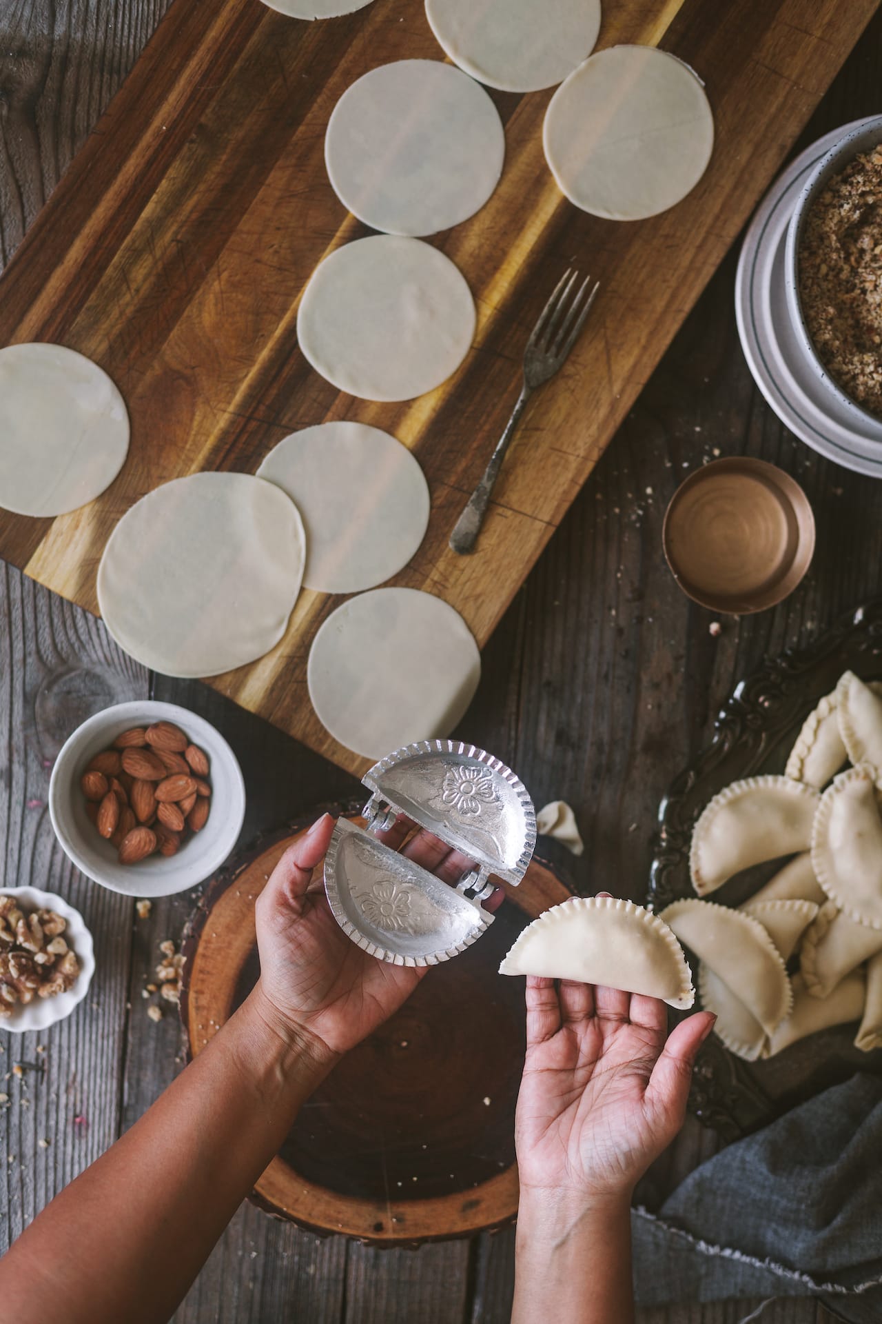 How to shape Indian flaky dessert, filled with solid milk and assorted nuts