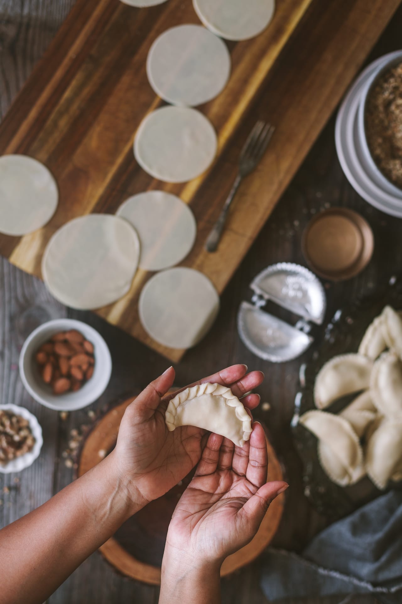 How to shape Indian flaky dessert, filled with solid milk and assorted nuts