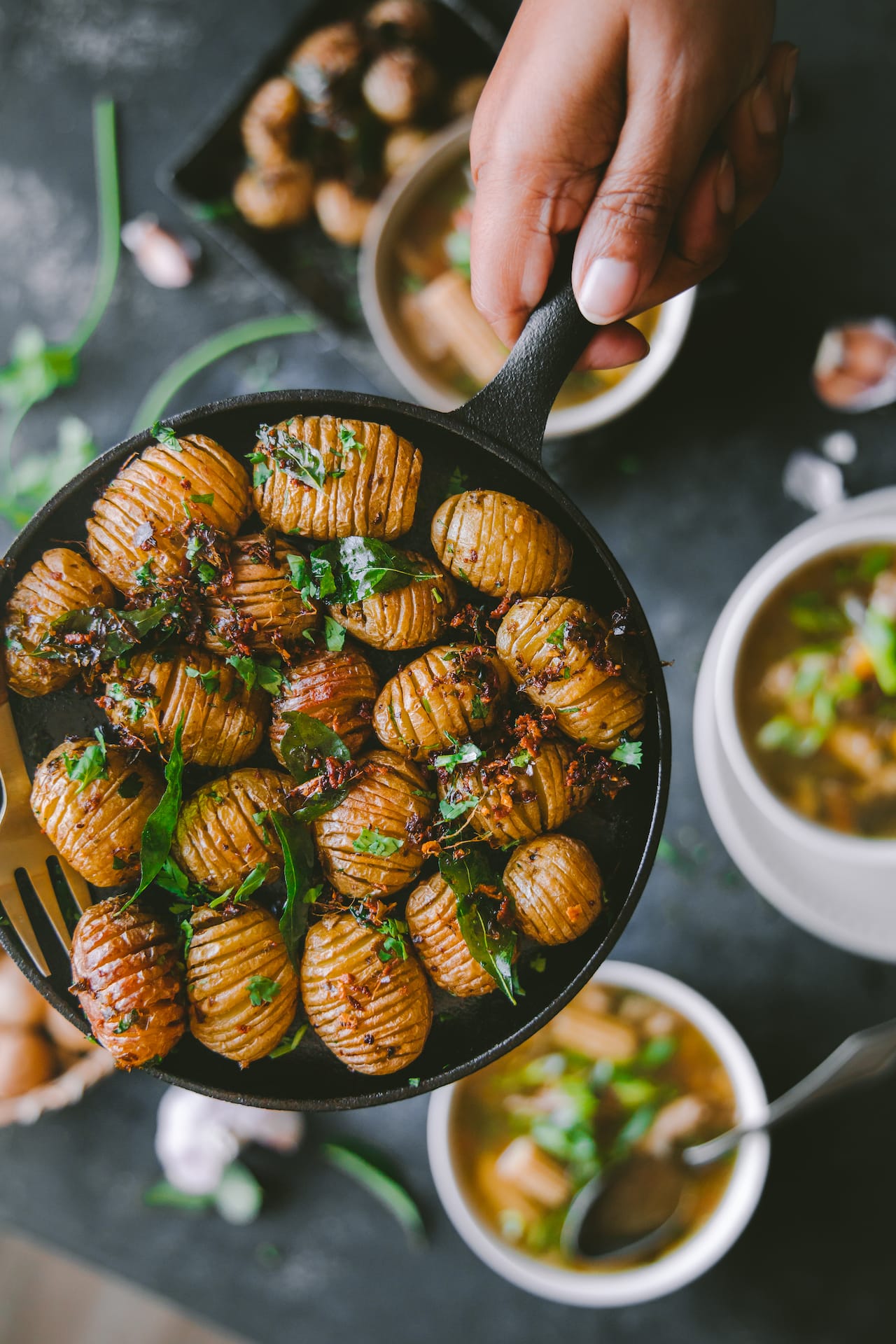 Hassleback Baby Potatoes with curry leaves and garlic